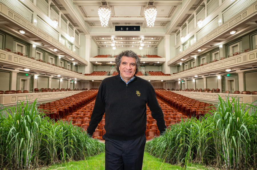 Conductor Giancarlo Guerrero Poses in a Baylor Sweater inside Nashville Symphony Orchestra Performance Hall